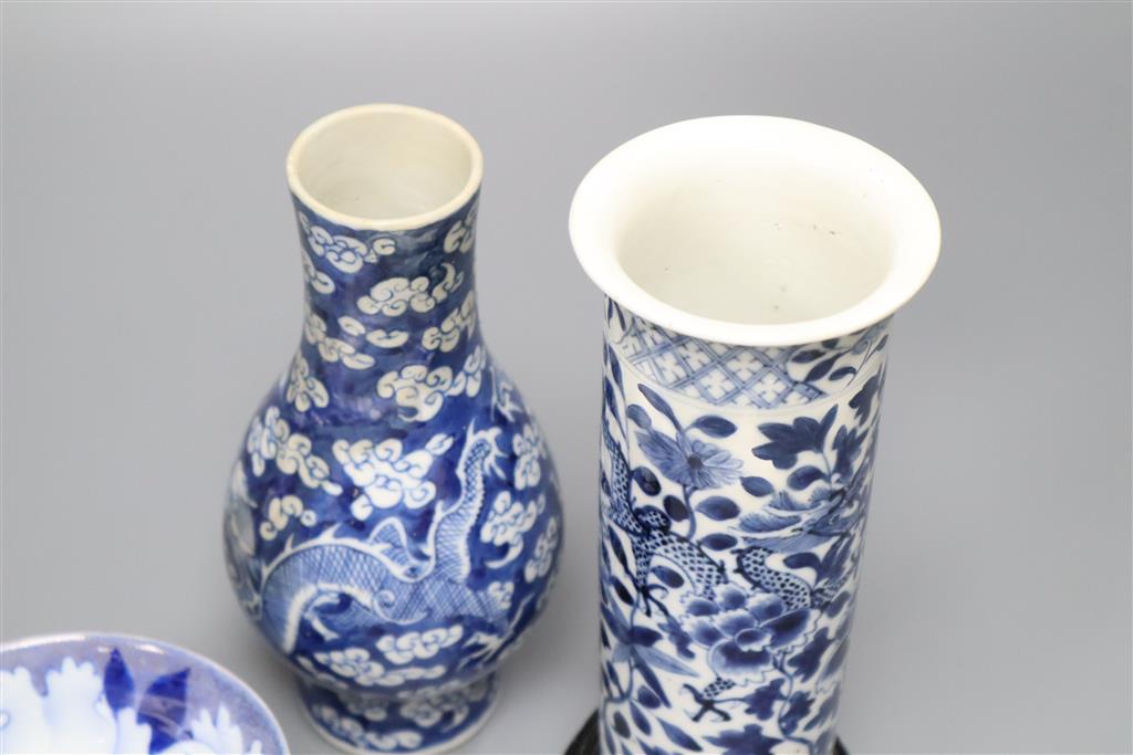 A Chinese blue and white vase with four-character mark, a similar cylindrical vase and a small bowl, tallest 21cm